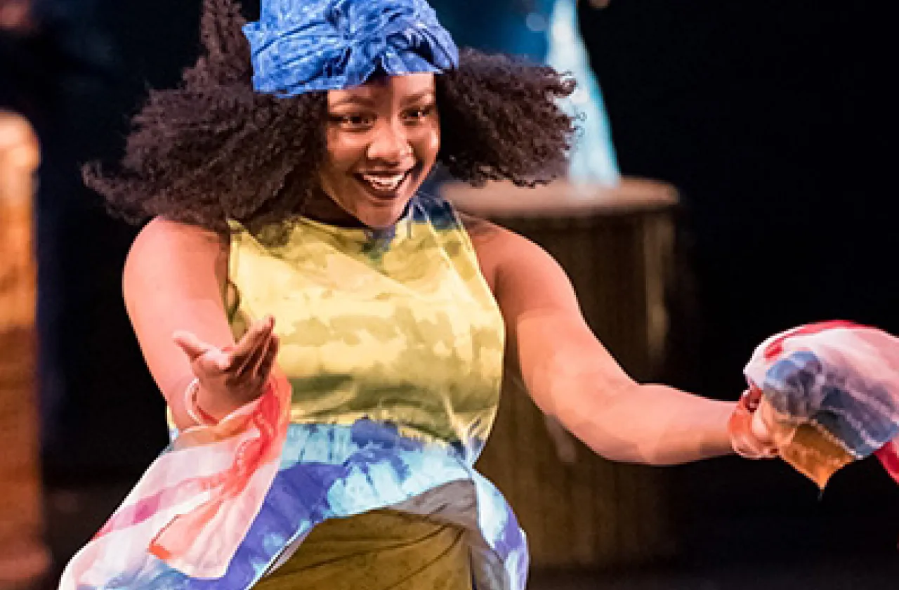 A grad student dancing in a performance.