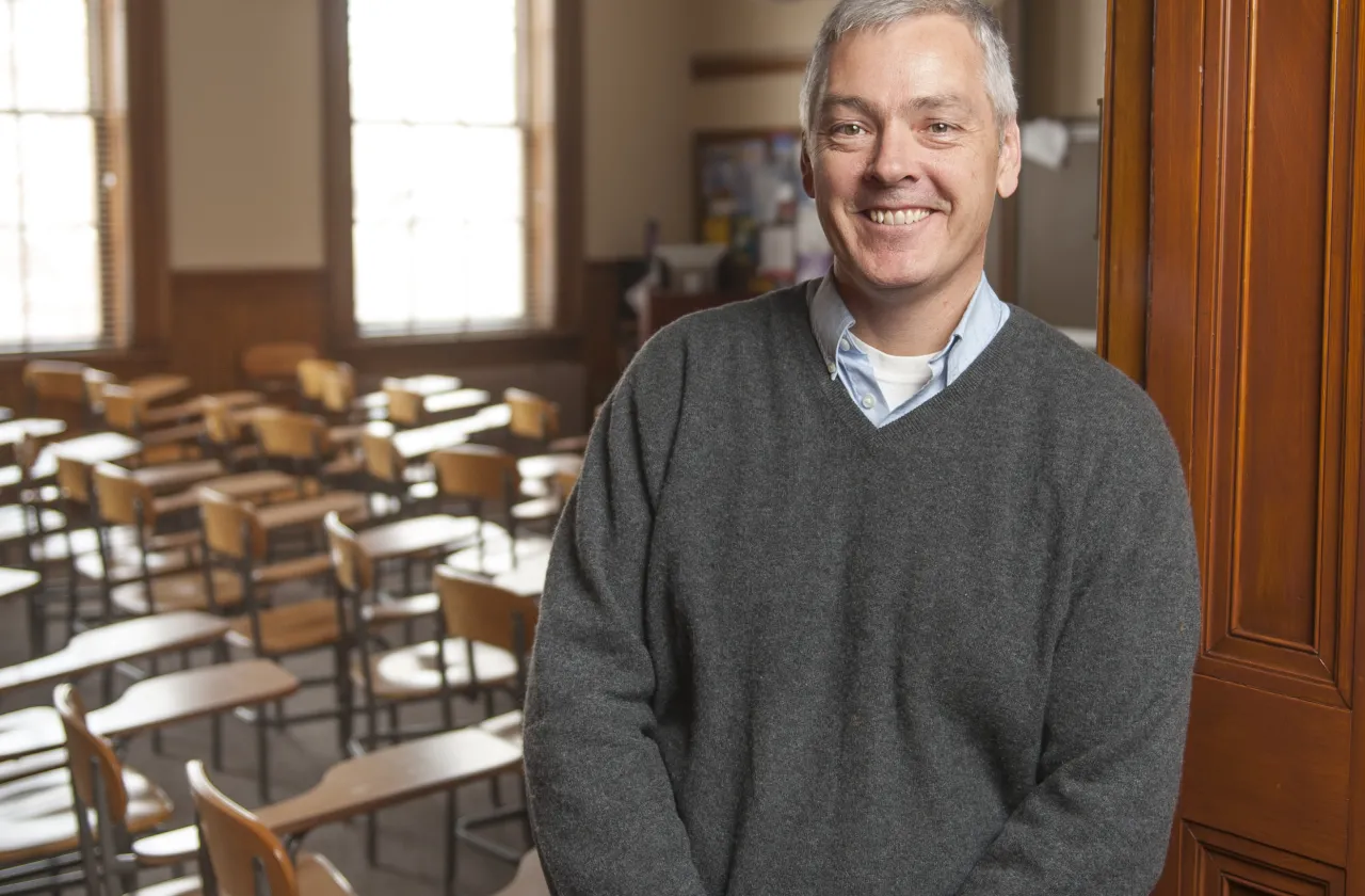 Smith College Professor Michael Thurston standing outside a classroom.