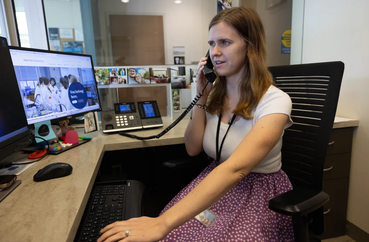 A Schacht Center receptionist talking on the phone