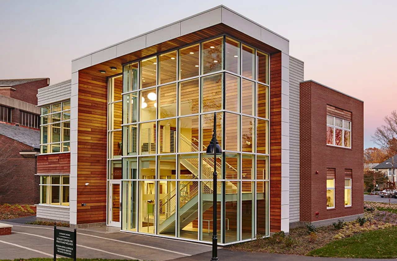glass and wood building against blue sky