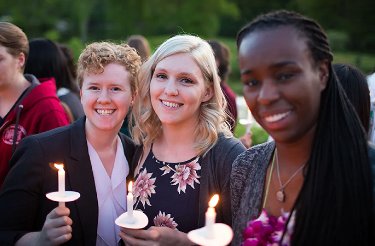 Photo of three students during Illumination