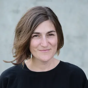 Headshot of Miciah Bay Gault smiling against a plain light background.