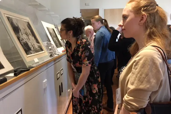 Maddy Greaves'18 (left) and Amanda Bolin '18 do some close looking at three rare Rembrandt prints during a study session at the Smith College Museum of Art.