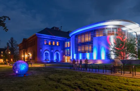 The exterior of Neilson Library is illuminated with lights during Illuminations