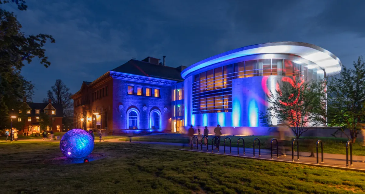 The exterior of Neilson Library is illuminated with lights during Illuminations