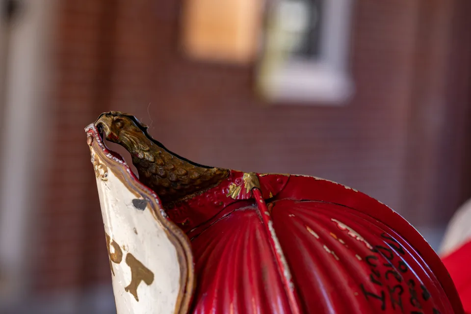 The bronze colored eagle on the crest of the Comstock fire helmet