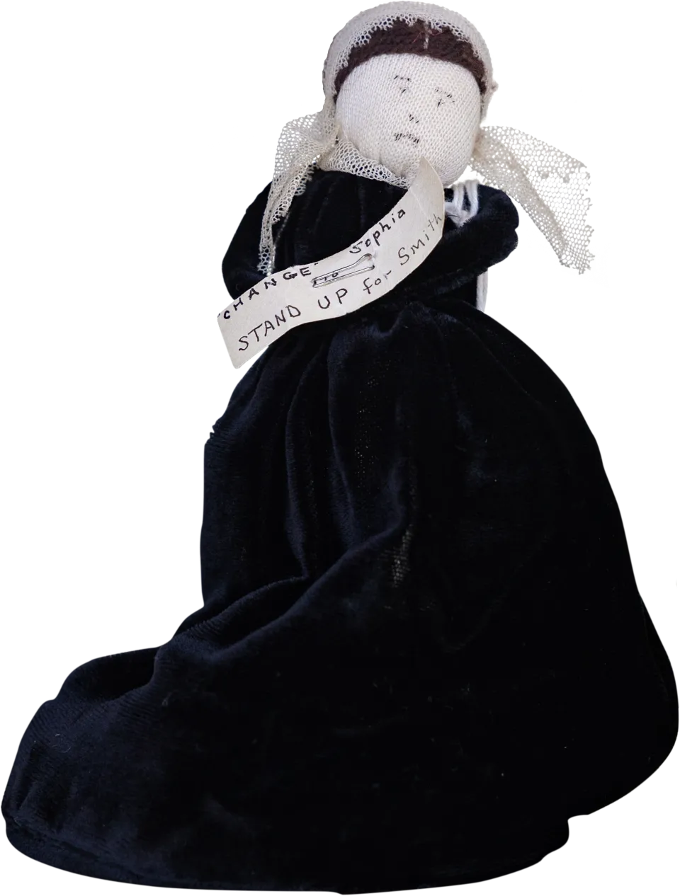 A vintage doll of Sophia Smith wearing a sash that says "Stand Up for Smith"