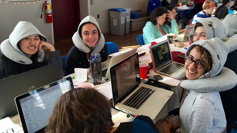 Students working on computers wearing Microsoft attire