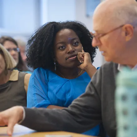 Faculty sitting around a table